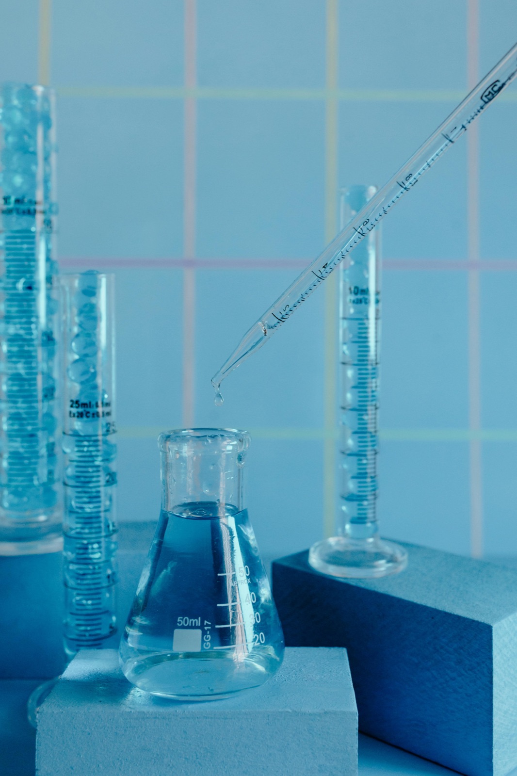 Laboratory pipette and glassware representing the EU cosmetic compliance work behind the 2026 regulations